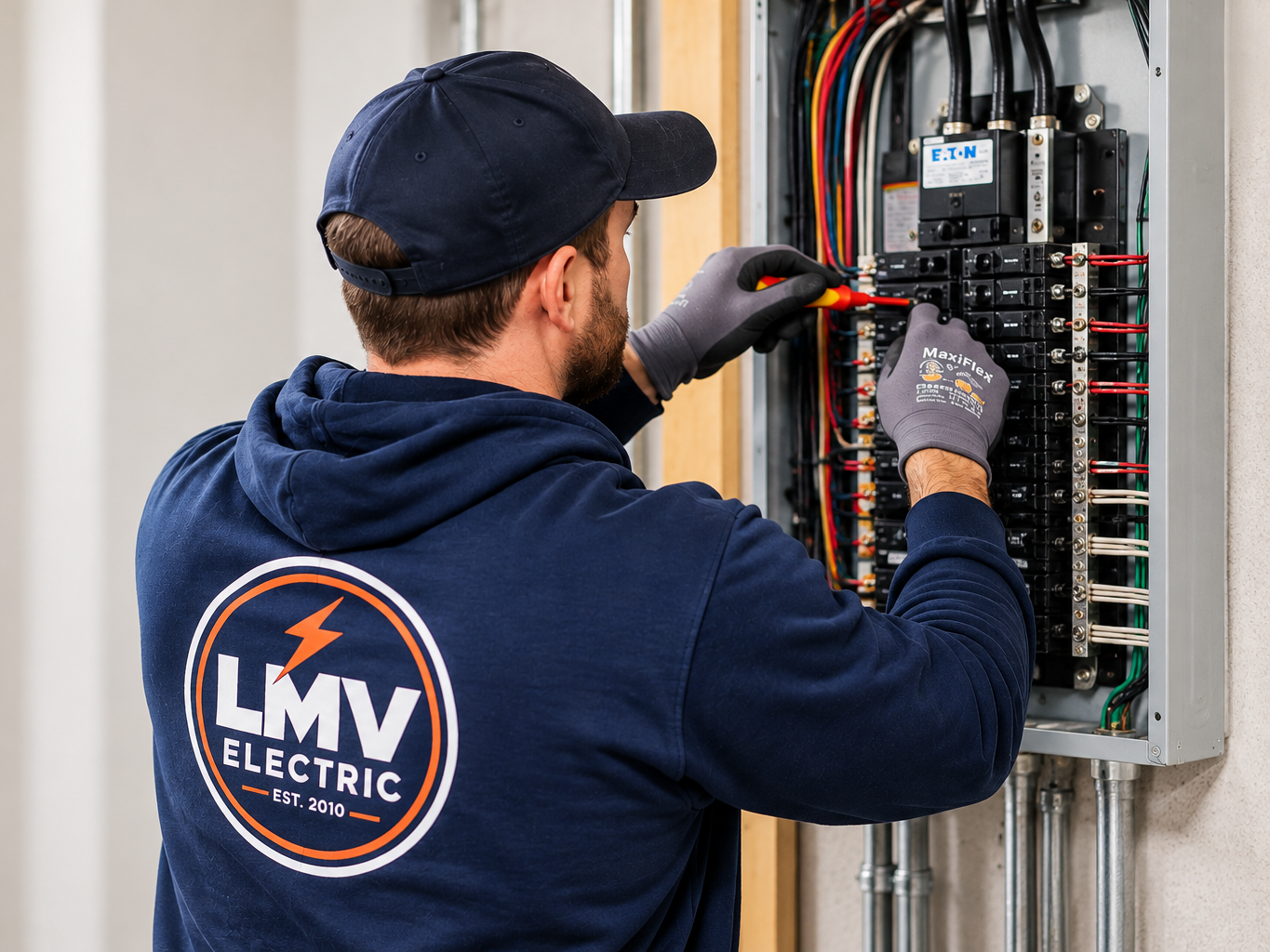 Electrician Servicing EATON Breaker Panel Photo